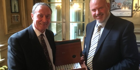 Phil Waters (left) being presented with a commemorative gift by Premier Paper Group Marketing Director David Jones