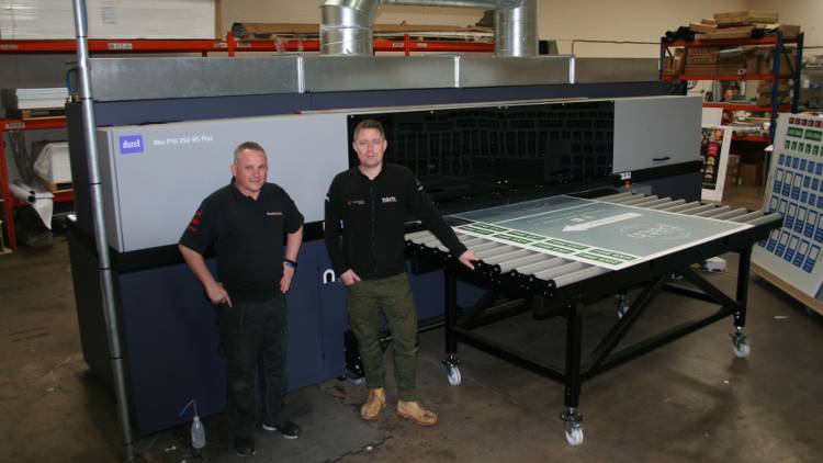 Taking business to another level with Durst investment. Colour Graphics Production manager John Hayes and James Birch in front of the Durst Rho P10.